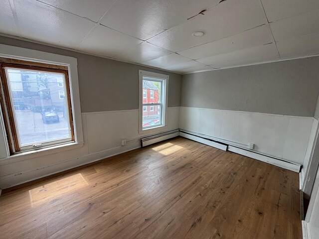 39 Foss St, Biddeford, ME 04005 - empty room featuring a wainscoted wall and wood finished floors