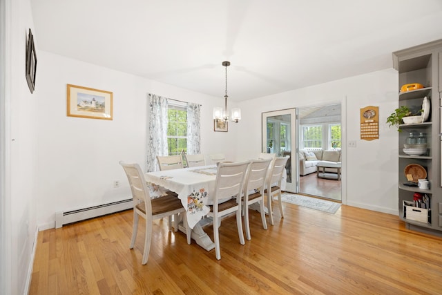 30 Maxfield Dr, Orono, ME 04473 - dining room featuring a baseboard heating unit, light wood-style floors, a chandelier, and baseboards