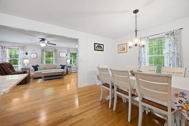 30 Maxfield Dr, Orono, ME 04473 - dining area with light wood-style floors, a chandelier, and a ceiling fan