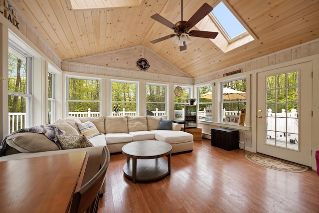 30 Maxfield Dr, Orono, ME 04473 - sunroom with a skylight, vaulted ceiling, plenty of natural light, wood-type flooring, and wooden ceiling