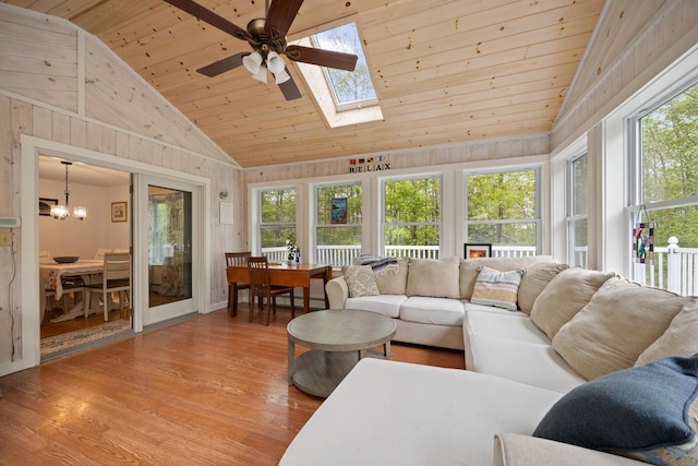 30 Maxfield Dr, Orono, ME 04473 - living room with a ceiling fan, wood ceiling, light wood-style flooring, a skylight, and lofted ceiling