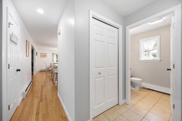 30 Maxfield Dr, Orono, ME 04473 - hallway featuring a baseboard radiator, plenty of natural light, and baseboard heating