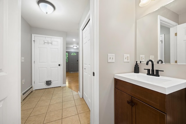 30 Maxfield Dr, Orono, ME 04473 - bathroom with a baseboard heating unit, tile patterned floors, and vanity