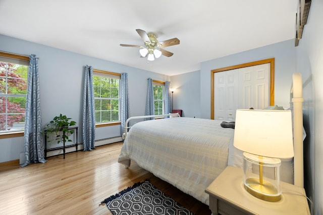 30 Maxfield Dr, Orono, ME 04473 - bedroom featuring wood finished floors, ceiling fan, a closet, and baseboards