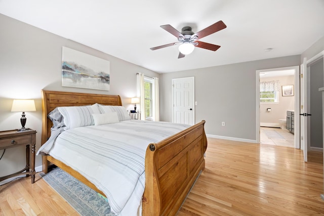 30 Maxfield Dr, Orono, ME 04473 - bedroom with light wood finished floors, multiple windows, baseboards, and a ceiling fan