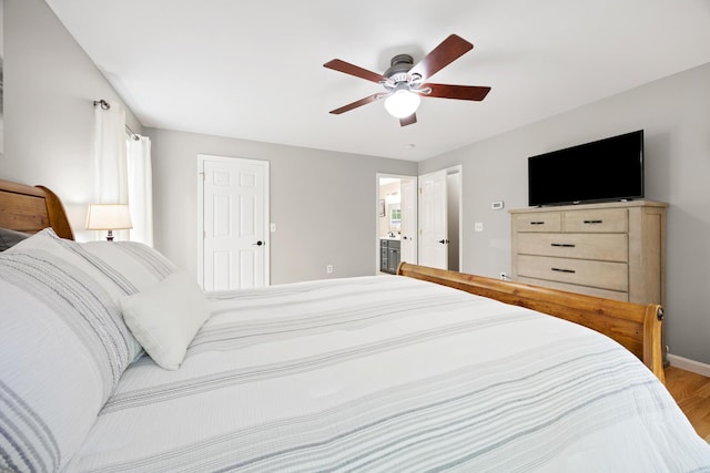 30 Maxfield Dr, Orono, ME 04473 - bedroom with wood finished floors, baseboards, a ceiling fan, and ensuite bath