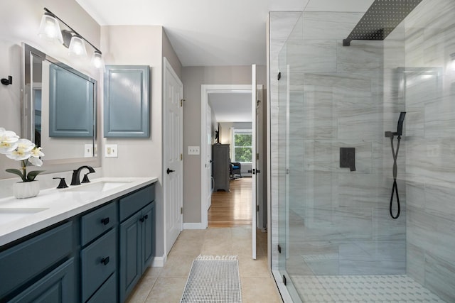 30 Maxfield Dr, Orono, ME 04473 - full bath with a shower stall, double vanity, tile patterned flooring, and baseboards