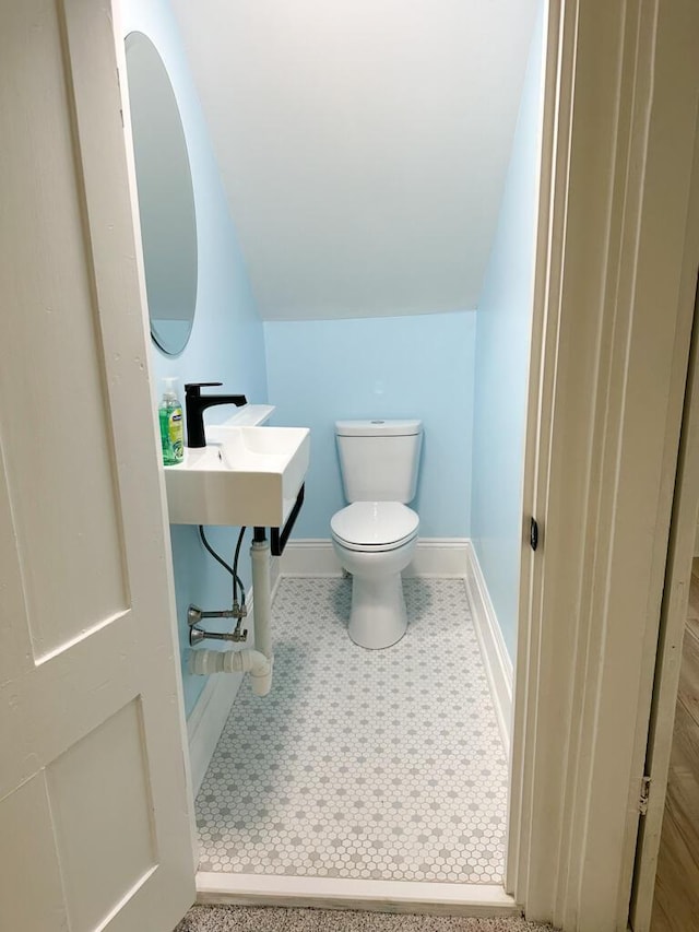 70 Pearl St, Bangor, ME 04401 - half bath with toilet, baseboards, and tile patterned floors