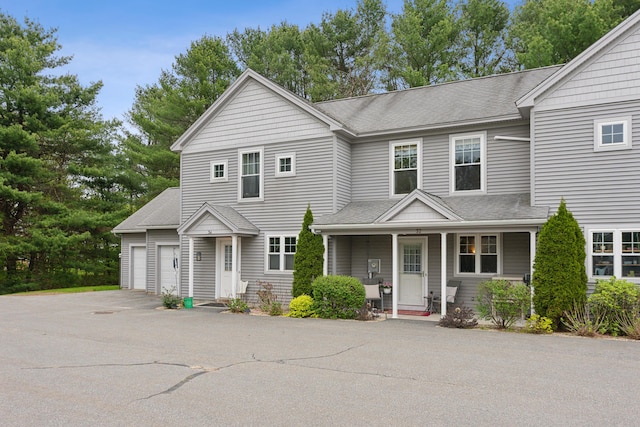 32 Edgefield Ln Unit 5, Brunswick, ME 04011 - view of front of property featuring roof with shingles, driveway, an attached garage, and covered porch