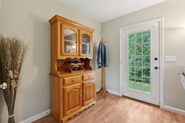 32 Edgefield Ln Unit 5, Brunswick, ME 04011 - doorway to outside featuring healthy amount of natural light, light wood-style floors, and baseboards