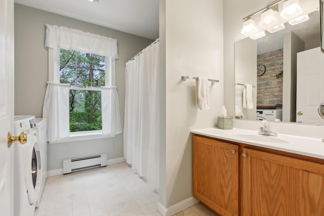 32 Edgefield Ln Unit 5, Brunswick, ME 04011 - bathroom featuring a baseboard heating unit, independent washer and dryer, vanity, baseboards, and tile patterned floors