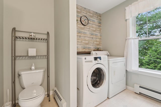 32 Edgefield Ln Unit 5, Brunswick, ME 04011 - washroom featuring a baseboard radiator, washing machine and clothes dryer, light tile patterned floors, baseboards, and wooden walls