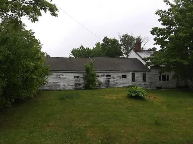 284 Old Brunswick Rd, Gardiner, ME 04345 - back of property with a yard and a chimney