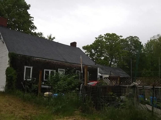 284 Old Brunswick Rd, Gardiner, ME 04345 - rear view of property featuring a chimney