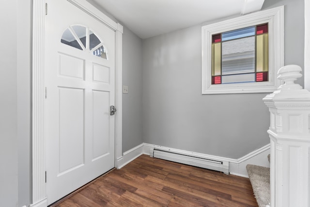 130 W Broadway, Bangor, ME 04401 - entryway featuring a baseboard heating unit, dark wood-style flooring, and stairway