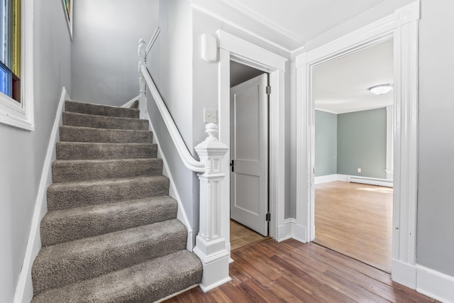 130 W Broadway, Bangor, ME 04401 - stairs featuring wood finished floors and baseboard heating