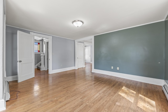 130 W Broadway, Bangor, ME 04401 - empty room with ornamental molding, light wood-type flooring, and a baseboard heating unit