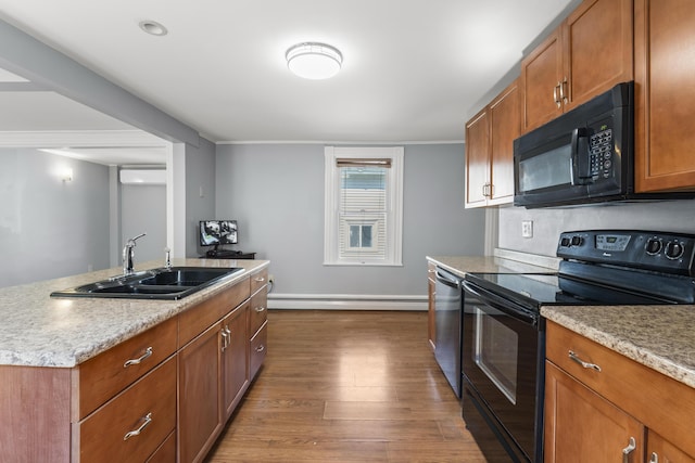 130 W Broadway, Bangor, ME 04401 - kitchen featuring black appliances, a baseboard radiator, dark wood-type flooring, brown cabinetry, and ornamental molding