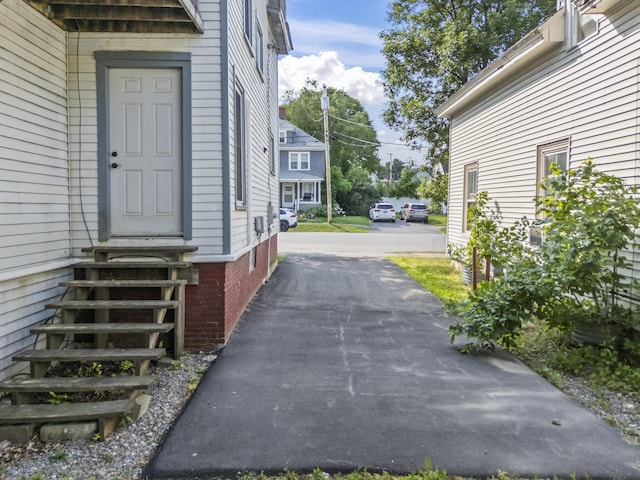 130 W Broadway, Bangor, ME 04401 - doorway to property featuring brick siding