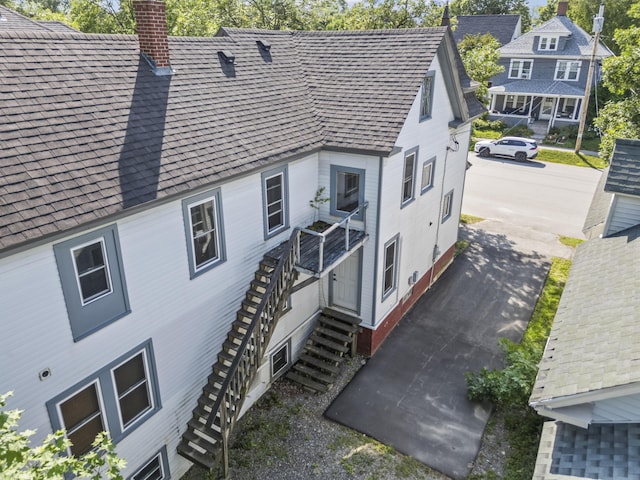 130 W Broadway, Bangor, ME 04401 - view of side of property with a chimney and stairs