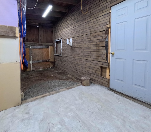 90 W Main St, Milo, ME 04463 - unfinished below grade area with brick wall