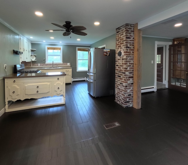 90 W Main St, Milo, ME 04463 - kitchen featuring stainless steel appliances, white cabinetry, open shelves, a sink, and ornamental molding