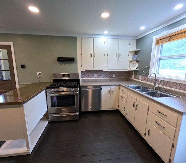 90 W Main St, Milo, ME 04463 - kitchen with appliances with stainless steel finishes, a sink, a peninsula, recessed lighting, and dark wood finished floors