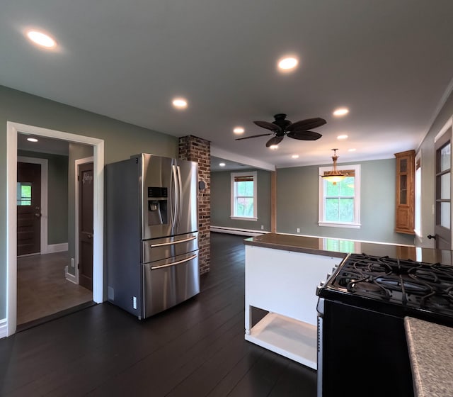 90 W Main St, Milo, ME 04463 - kitchen featuring stainless steel fridge, gas range oven, a ceiling fan, recessed lighting, and dark wood-style flooring