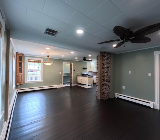 90 W Main St, Milo, ME 04463 - unfurnished living room with baseboard heating, a ceiling fan, dark wood-style floors, recessed lighting, and crown molding