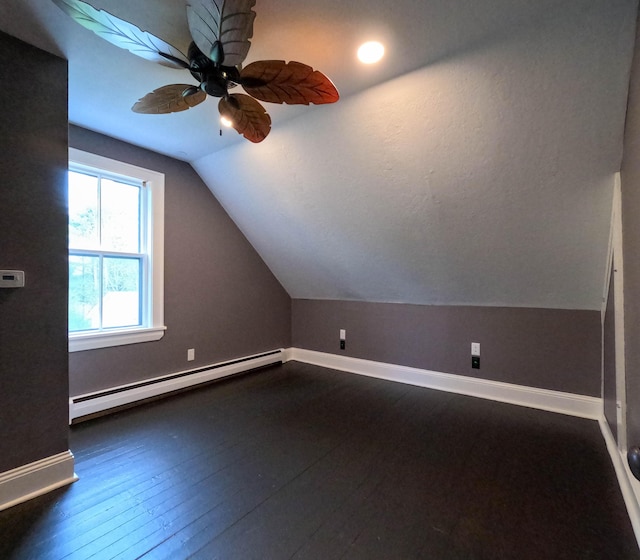 90 W Main St, Milo, ME 04463 - bonus room with a baseboard radiator, lofted ceiling, baseboards, dark wood finished floors, and a ceiling fan