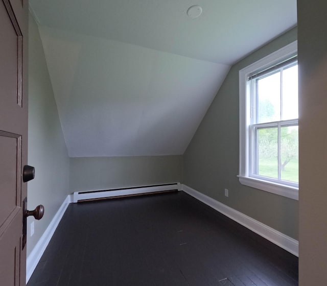 90 W Main St, Milo, ME 04463 - bonus room featuring baseboard heating, lofted ceiling, baseboards, and dark wood-style flooring