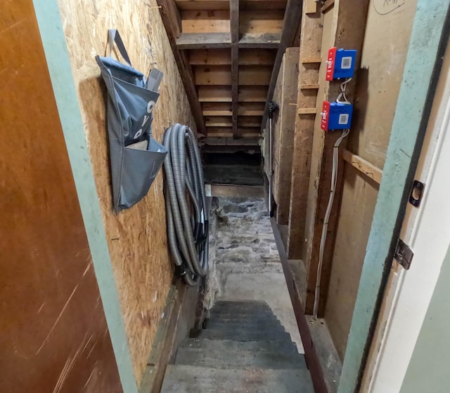 90 W Main St, Milo, ME 04463 - staircase featuring unfinished concrete floors
