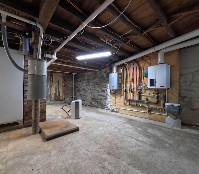 90 W Main St, Milo, ME 04463 - unfinished basement with a central vacuum unit and tankless water heater