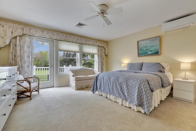 2 Round Cove Ln Unit 2, Phippsburg, ME 04562 - carpeted bedroom with a wall mounted air conditioner, access to outside, and a ceiling fan