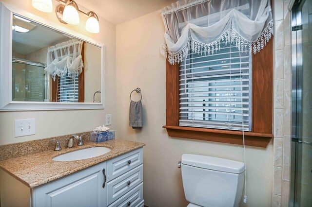 17 Bank Rd, York, ME 03909 - full bath with vanity, a stall shower, and toilet