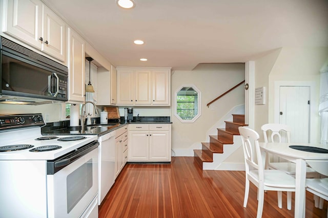 17 Bank Rd, York, ME 03909 - kitchen featuring white appliances, white cabinetry, a sink, light wood-style floors, and recessed lighting