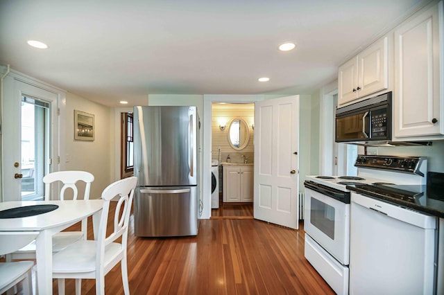 17 Bank Rd, York, ME 03909 - kitchen featuring black microwave, electric range, freestanding refrigerator, washer / clothes dryer, and dark wood finished floors