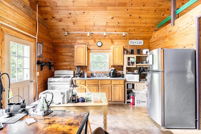 639 Main St, Springfield, ME 04487 - kitchen with white appliances, vaulted ceiling, plenty of natural light, wood walls, and wood ceiling