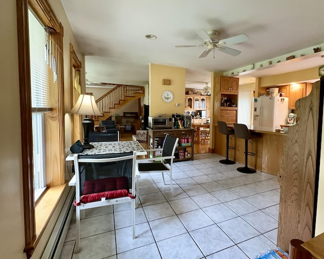 224 E Waterman Rd, Auburn, ME 04210 - living room with stairs, ceiling fan, plenty of natural light, and light tile patterned floors
