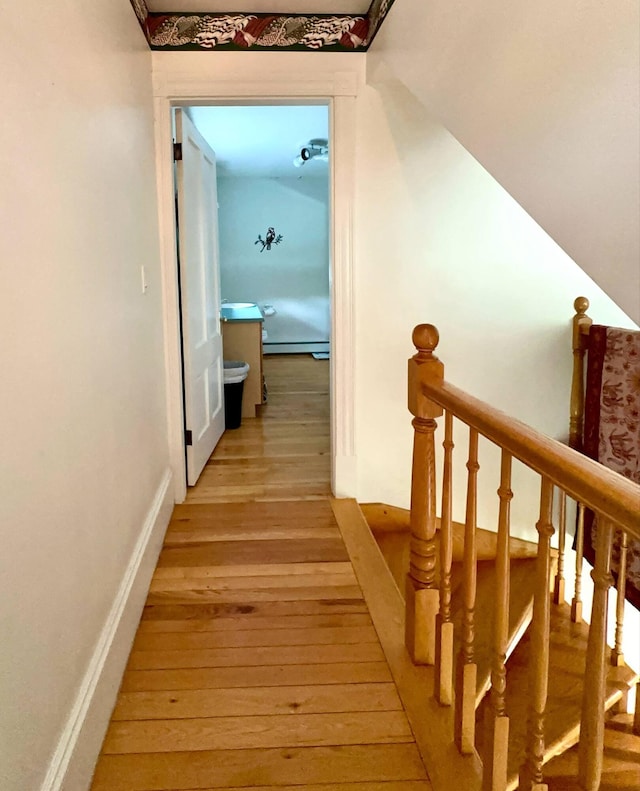 224 E Waterman Rd, Auburn, ME 04210 - corridor featuring light wood-style flooring and a baseboard heating unit