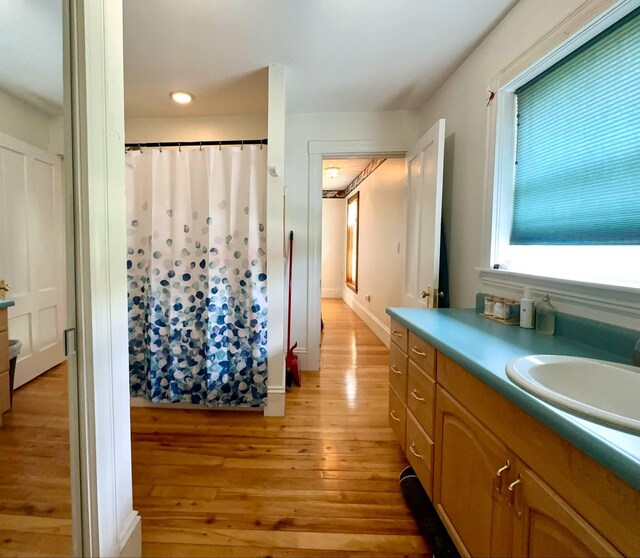 224 E Waterman Rd, Auburn, ME 04210 - bathroom featuring wood finished floors, vanity, a shower with shower curtain, and recessed lighting