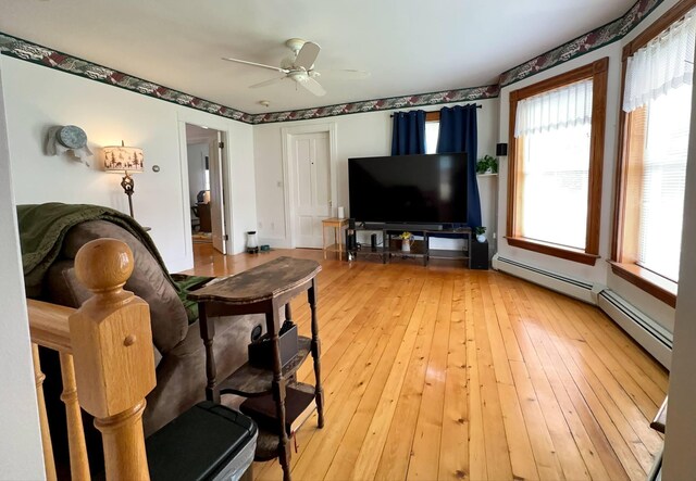 224 E Waterman Rd, Auburn, ME 04210 - living area featuring healthy amount of natural light, ceiling fan, and light wood-type flooring