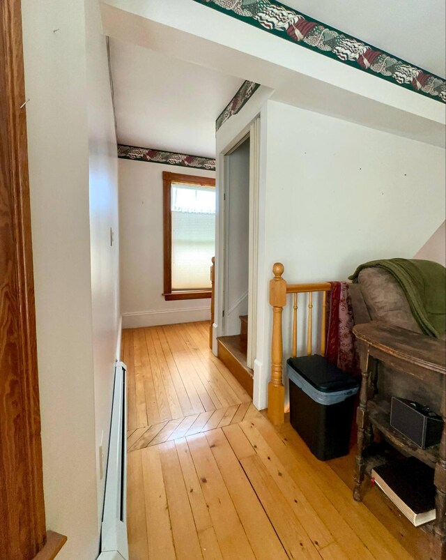 224 E Waterman Rd, Auburn, ME 04210 - hall featuring light wood finished floors, baseboards, baseboard heating, and stairs