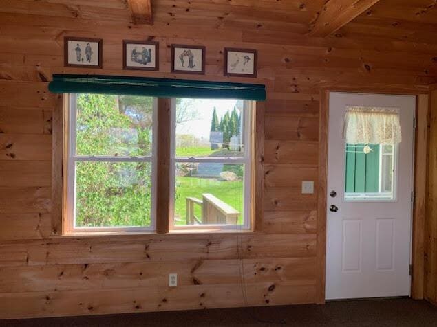 38 Cove Ln, Union, ME 04862 - doorway with beam ceiling and wooden walls