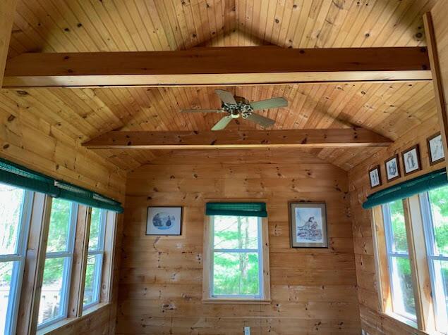38 Cove Ln, Union, ME 04862 - detailed view of wooden ceiling with exposed beams, ceiling fan, and wood walls