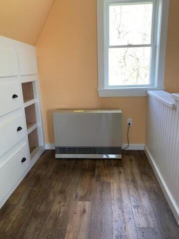 38 Cove Ln, Union, ME 04862 - additional living space with dark wood-type flooring, heating unit, vaulted ceiling, and baseboards