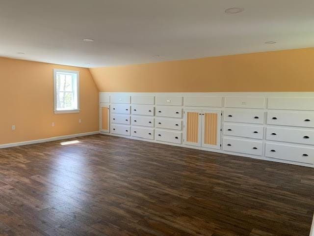 38 Cove Ln, Union, ME 04862 - additional living space with dark wood-style flooring, lofted ceiling, baseboards, and mail area