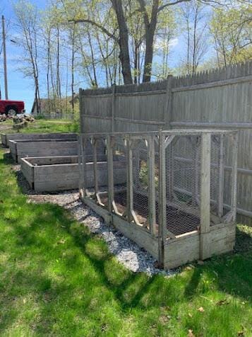 38 Cove Ln, Union, ME 04862 - view of yard featuring a vegetable garden, exterior structure, and an outdoor structure