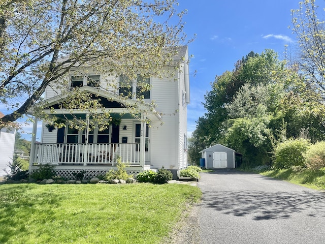 72 Winship St, Bath, ME 04530 - view of front of home with a porch, an outdoor structure, a front yard, and asphalt driveway