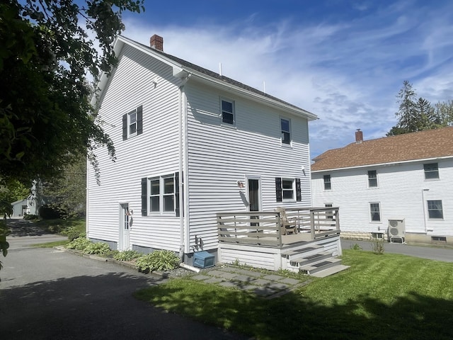 72 Winship St, Bath, ME 04530 - back of property with a chimney, a deck, and a lawn